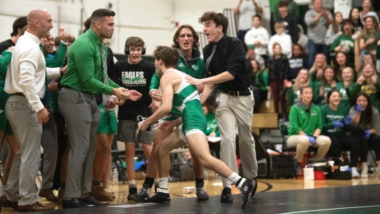 West Deptford's Anthony Catando celebrates with his teammates and coaches after Catando pinned Paulsboro's Audre Hill during the 120 lb. bout of the wrestling meet held at West Deptford High School on Thursday, January 4, 2024.