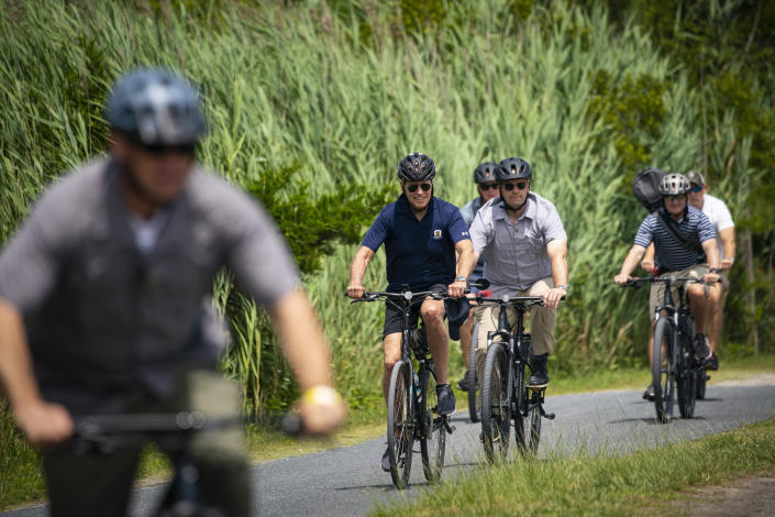 President Joe Biden bicycles near his home in Rehoboth Beach, Del. on July 10, 2022. (Al Drago/The New York Times)