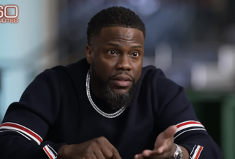 Kevin Hart wearing a striped sweater during a "60 Minutes" interview