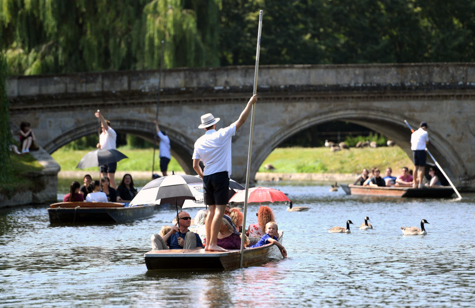 People punt along the River Cam in Cambridge, as the UK could encounter the hottest July day on record later this afternoon.