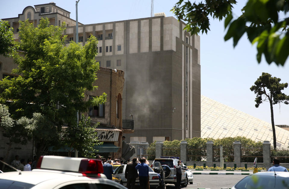 <p>Smoke is seen during a gunmen attack at the parliament’s building in central Tehran, Iran, June 7, 2017. (Photo: TIMA via Reuters) </p>