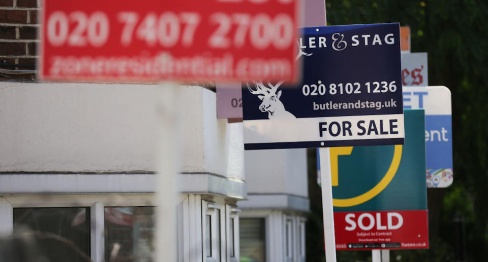 Estate agents placards are seen in front of houses in London (Photo credit: DANIEL LEAL-OLIVAS/AFP/Getty Images)