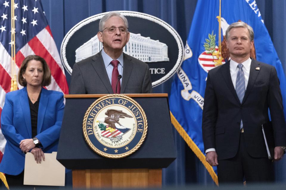 Attorney General Merrick Garland flanked by Deputy Attorney General Lisa Monaco, left, and Federal Bureau of Investigation (FBI) Director Christopher Wray speaks during a news conference to announce an international ransomware enforcement action, at the Department of Justice in Washington, Thursday, Jan. 26, 2023. The FBI has seized the website of a prolific ransomware gang that has heavily targeted hospitals and other healthcare providers. (AP Photo/Jose Luis Magana)