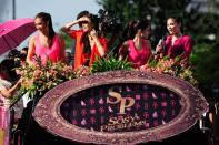 The cast of the MMFF 2012 entry "Sosy Problems" waves to the crowd as their float makes its way at the 2012 Metro Manila Film Festival Parade of Stars on 23 December 2012. (Angela Galia/NPPA Images)