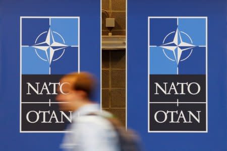 NATO signs are seen ahead of the Summit in Brussels, Belgium, July 10, 2018. REUTERS/Paul Hanna/File Photo