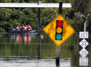 A rescue team navigates their boat through the flooded streets as the Tar River crests in the aftermath of Hurricane Matthew, in Princeville, North Carolina on October 13, 2016. REUTERS/Jonathan Drake