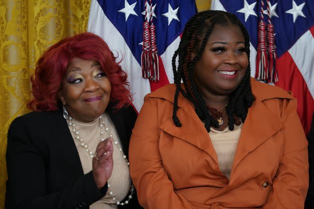 Fulton County, Georgia, election workers, Ruby Freeman (L) and daughter Shaye Moss attend an event on the second anniversary of the Jan. 6, 2021, attack on the U.S. Capitol, during a ceremony in the East Room of the White House in Washington, D.C., on Jan. 6, 2023. 