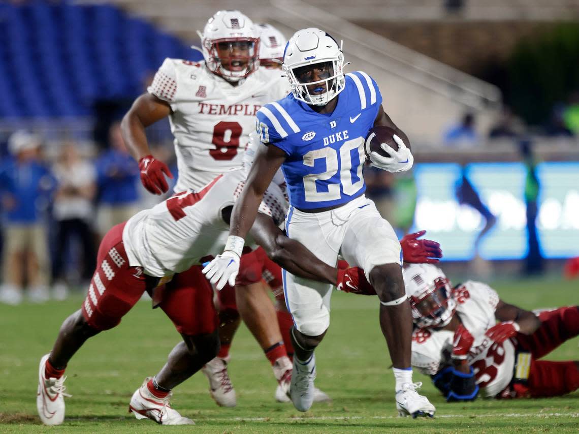 Duke running back Jaquez Moore (20) runs the ball past the Temple defense during the Blue Devils season opener at Wallace Wade Stadium on Friday, Sept. 2, 2022, in Durham, N.C.