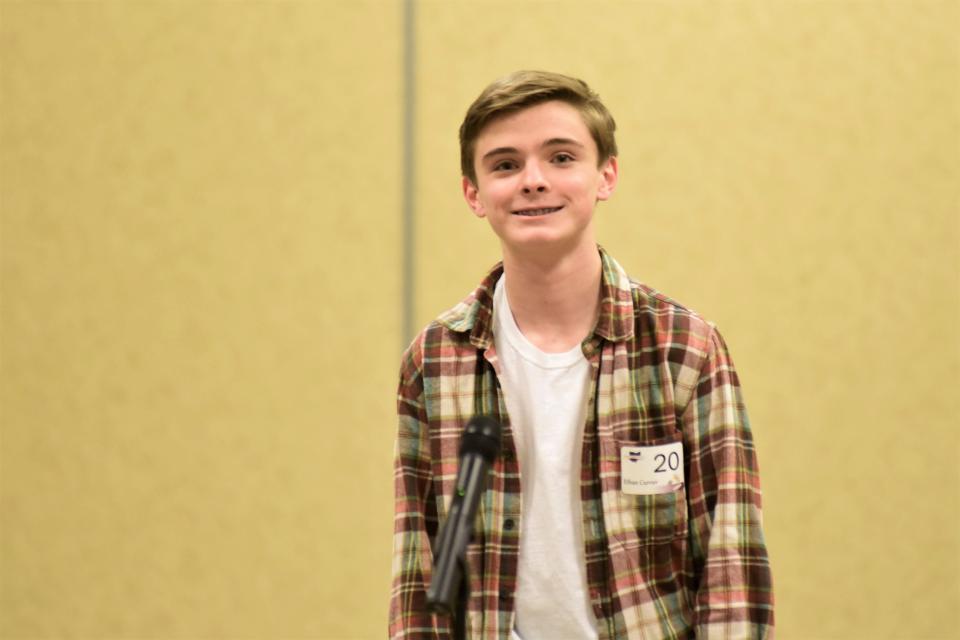 Ethan Currier, an eighth-grade student from Lexington, smiles Thursday night after winning the tri-county spelling bee.