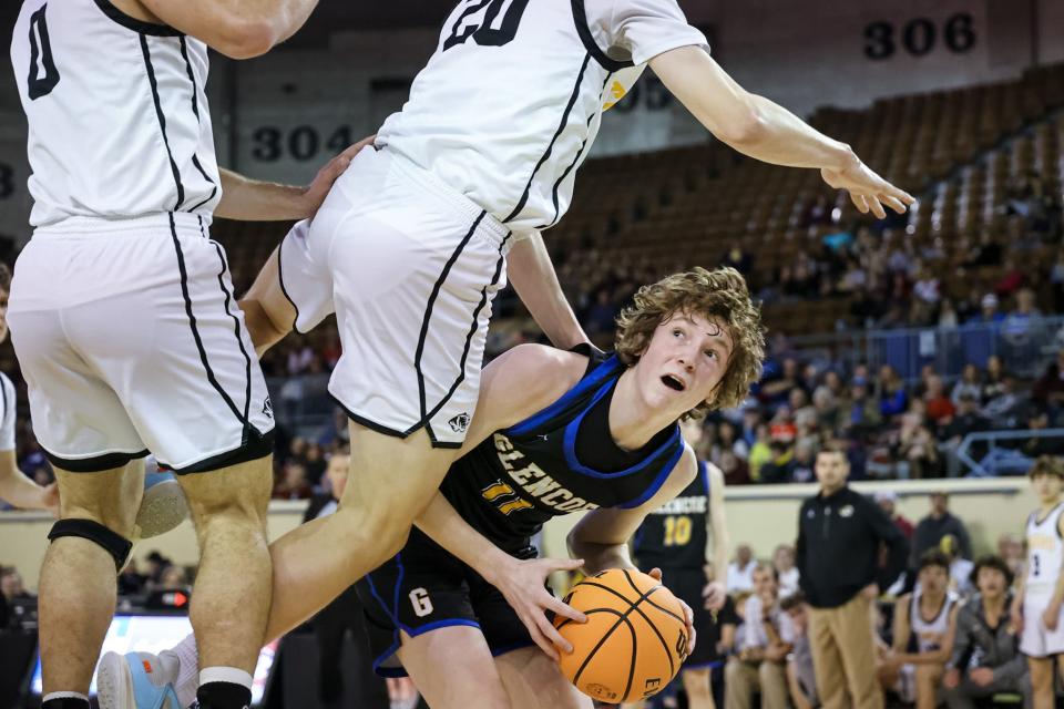 Glencoe’s Logan Vyrostek (11) tries to work past Roff’s Brand Wilson (20) during a 52-43 win Thursday in a Class B quarterfinal at State Fair Arena.