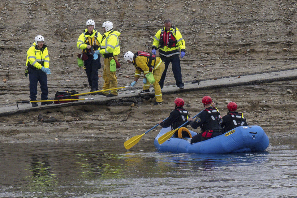 A swift water rescue team from the Ontario Fire Dept. rides in a raft on flood waters in a flood control channel in Ontario, Calif. on Tuesday, Nov. 8, 2022. (Watchara Phomicinda/The Orange County Register via AP)