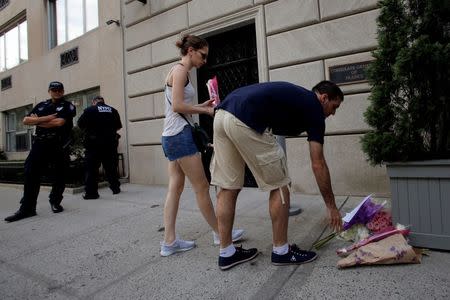 People lay flowers at the Consulate General of France in Manhattan following the Nice terror attack in New York, U.S., July 15, 2016. REUTERS/Andrew Kelly