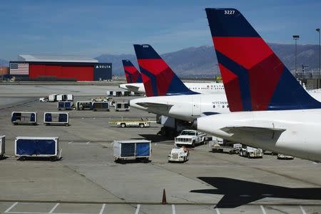 Delta planes line up at their gates while on the tarmac of Salt Lake City International Airport in Utah September 28, 2013. REUTERS/Lucas Jackson