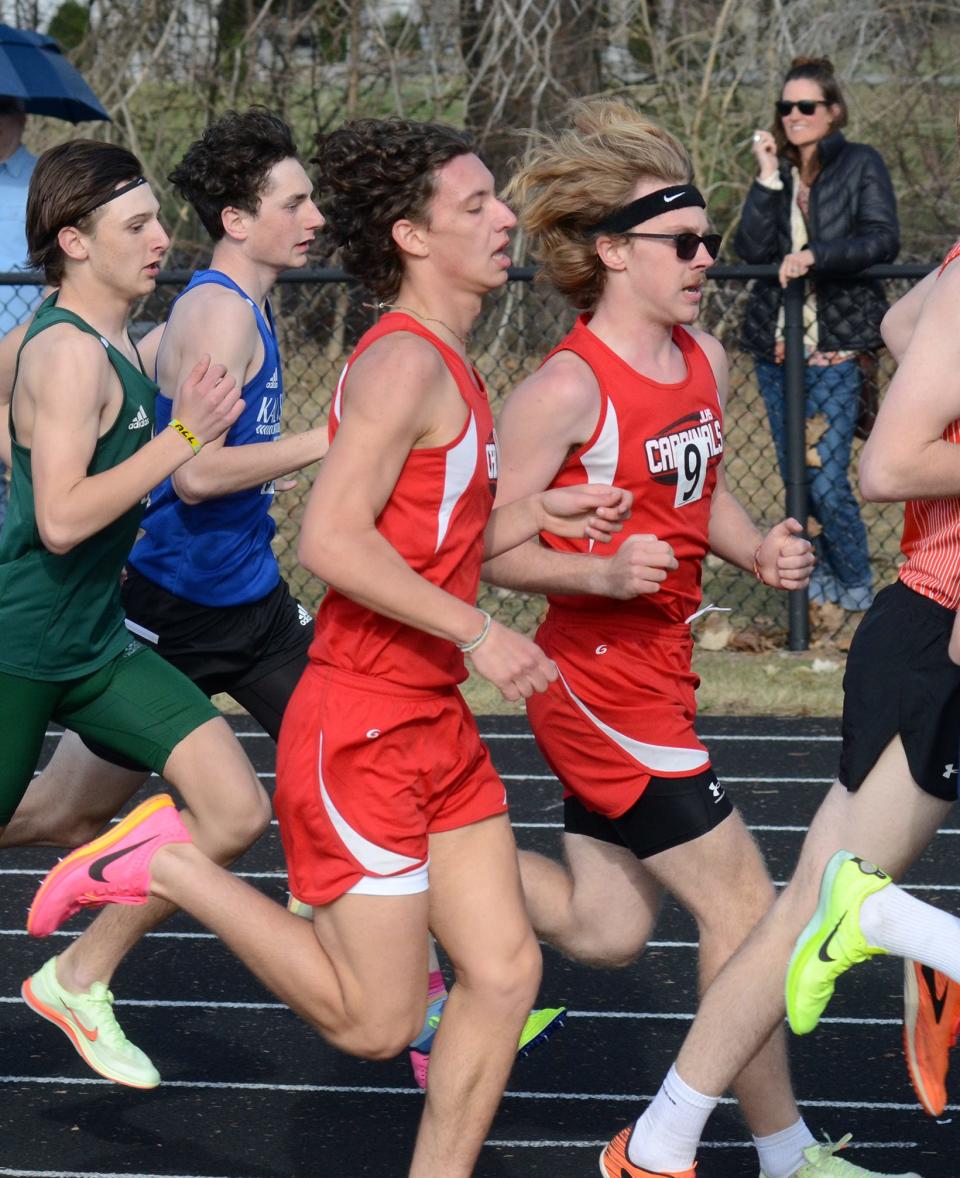 Malaki Gascho (left) competes in the 1600-meter run during the Harbor Springs Ram Scram on Friday, April 14.