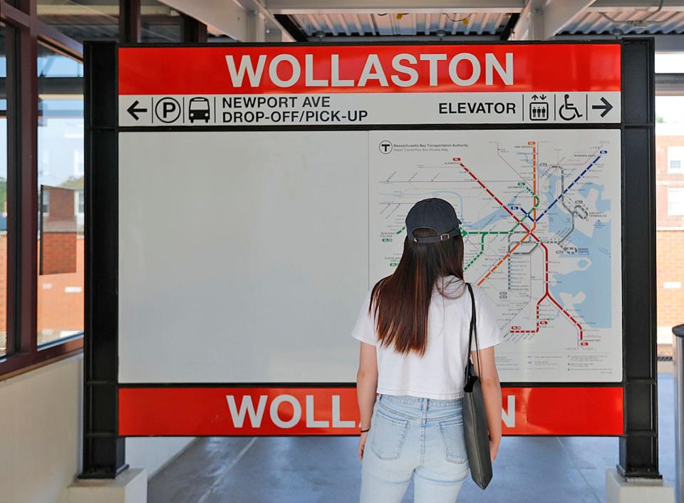 A woman looks at the large MBTA subway map at the Wollaston Station on Tuesday, July 27, 2021.
