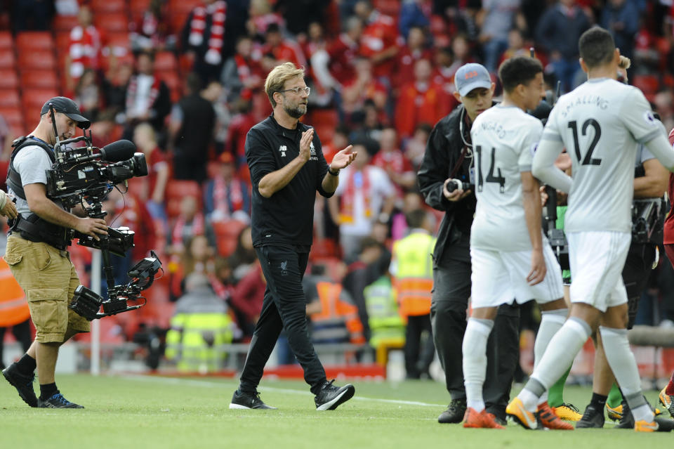 Liverpool coach Jurgen Klopp claps his Liverpool side off the pitch