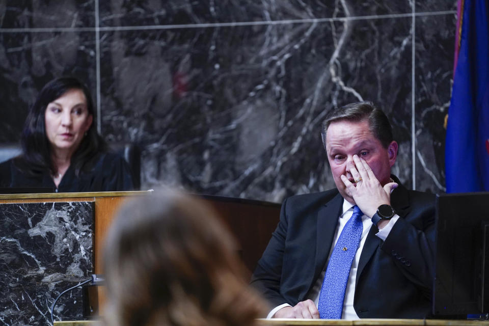 Forensic expert Edward Wagrowski becomes emotional as he testifies during James Crumbley's trial in the Oakland County courtroom of Cheryl Matthews on Thursday, March. 7, 2024 in Pontiac, Mich. James Crumbley, 47, is charged with four counts of involuntary manslaughter, one for each teenager killed by Ethan Crumbley at Oxford High School in 2021. (Mandi Wright/Detroit Free Press via AP, Pool)