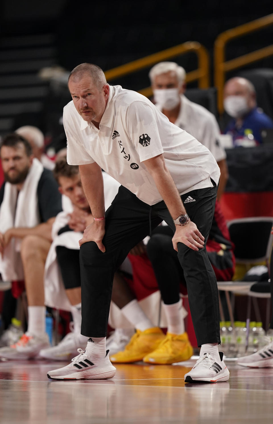 Germany's head coach Henrik Roedl watches during men's basketball preliminary round game against Nigeria at the 2020 Summer Olympics, Wednesday, July 28, 2021, in Saitama, Japan. (AP Photo/Charlie Neibergall)