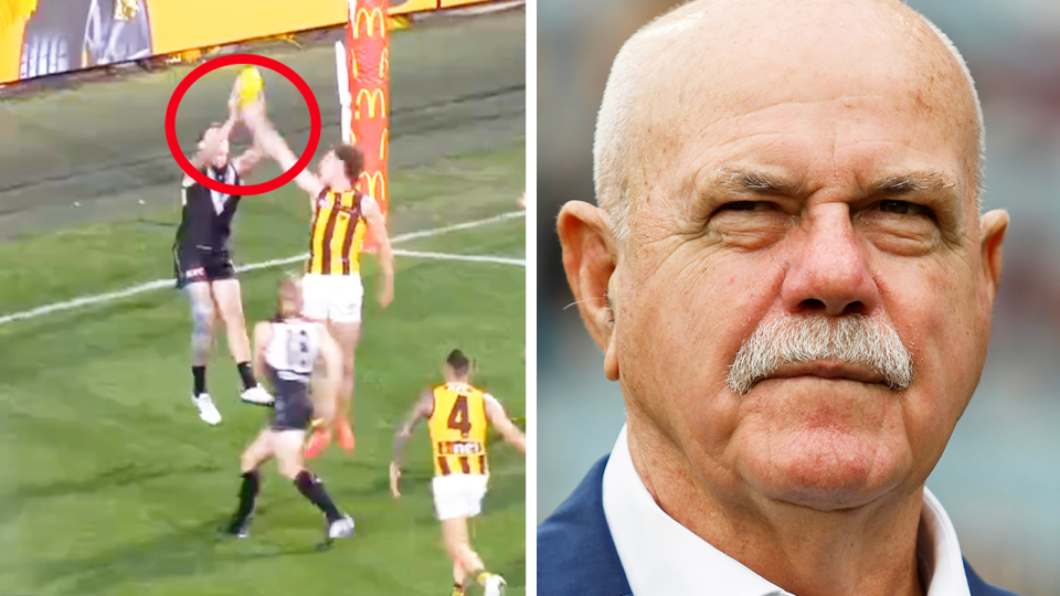 Mitch Georgiades takes a mark and AFL legend Leigh Matthews.