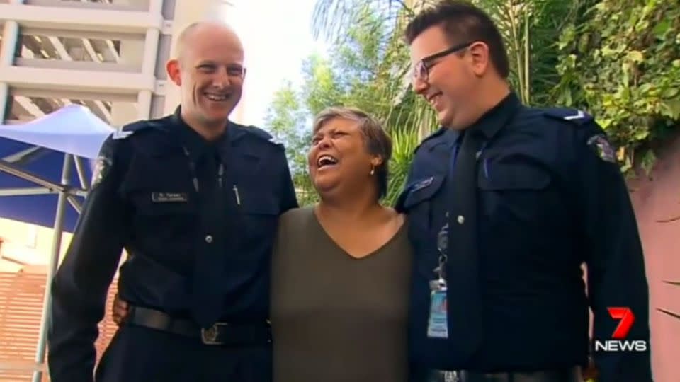 Mrs Adams shares a laugh with Senior Constable Dean Turner and First Constable Tom O'Dwyer. Photo: 7News