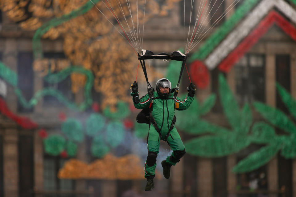 VARIOUS CITIES, MEXICO - SEPTEMBER 16: A Parachuter of the Mexican army takes part in the Independence Day military parade at Zocalo Square on September 16, 2020 in Various Cities, Mexico. This year El Zocalo remains closed for general public due to coronavirus restrictions. Every September 16 Mexico celebrates the beginning of the revolution uprising of 1810. (Photo by Hector Vivas/Getty Images)