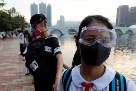 Anti-government protesters form a human chain in Hong Kong