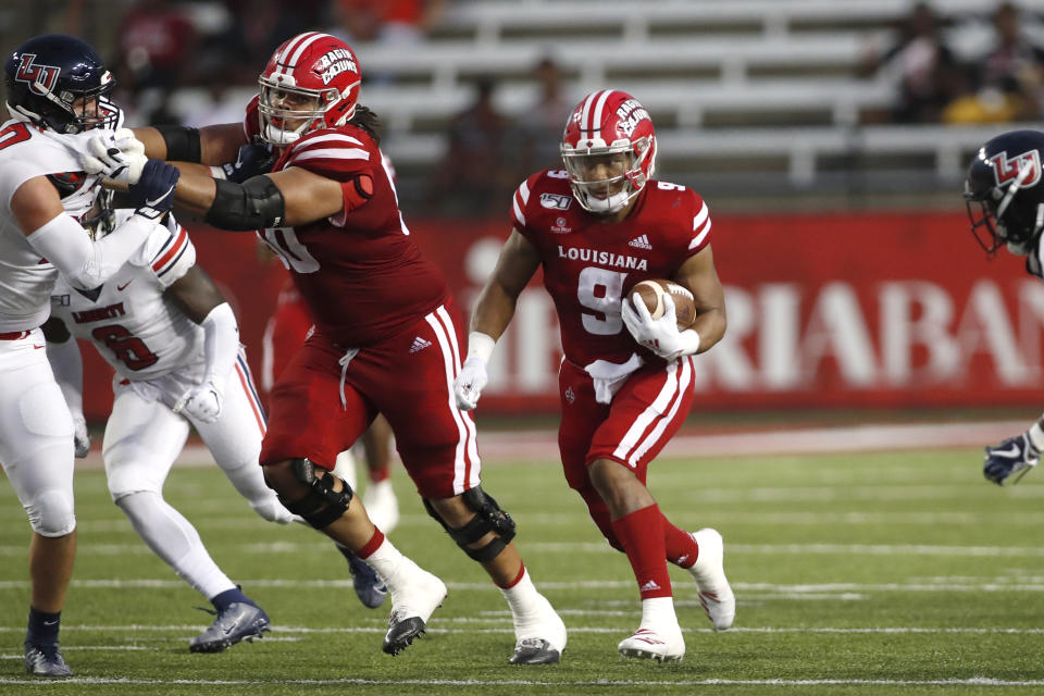 Louisiana Lafayette offensive lineman Robert Hunt (50) blocks for running back Trey Ragas on September 7, 2019, in Lafayette, La. (AP Photo/Tyler Kaufman)