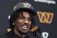 Washington Commanders first round draft pick Jayden Daniels speaks to reporters during an NFL football news conference in Ashburn, Va., Friday, April 26, 2024. (AP Photo/Manuel Balce Ceneta)