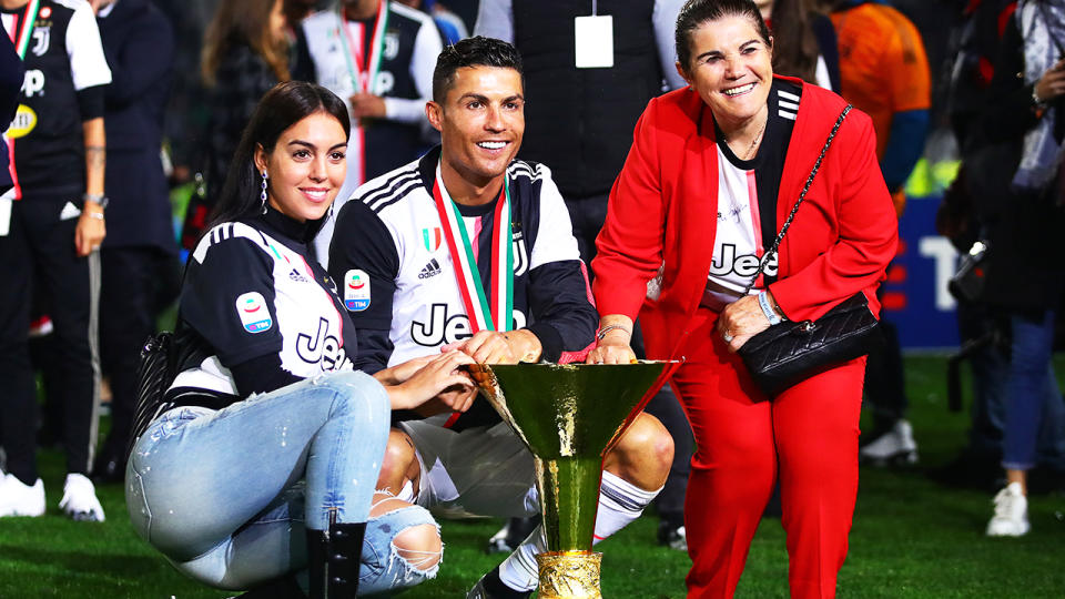 Cristiano Ronaldo, pictured here with girlfriend Georgina Rodri­guez and mother Maria Dolores dos Santos Aveiro in May 2019.