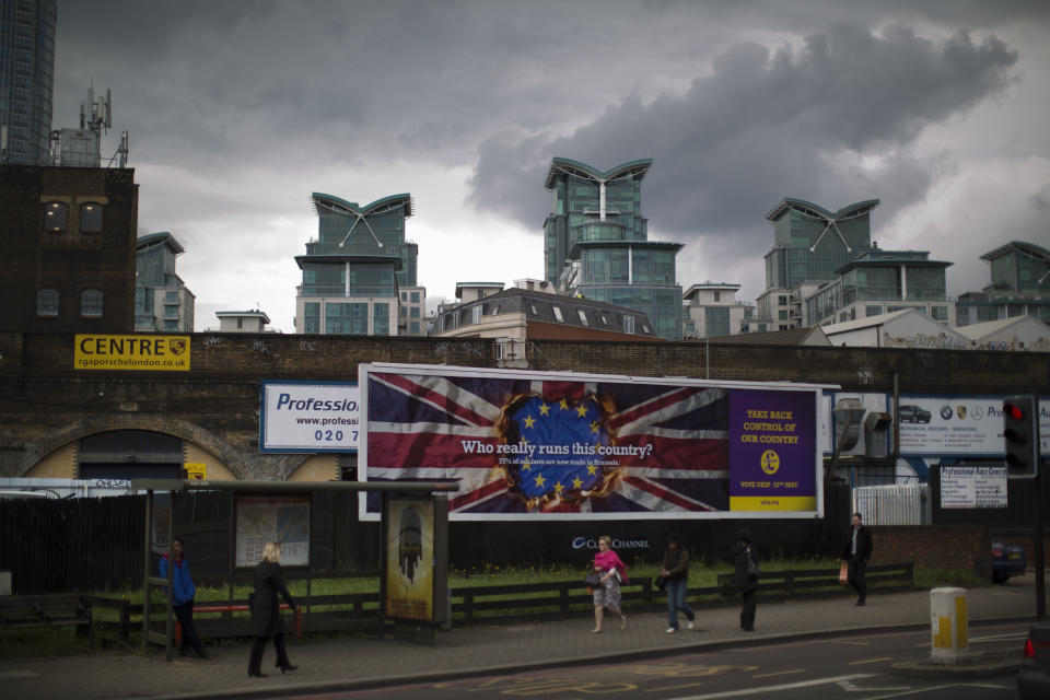 A UKIP European election billboard is displayed in the Vauxhall area of London, Tuesday, April 22, 2014. Britain's U.K. Independence Party has launched its European election campaign with a series of billboards carrying a stark message: They are coming to take your job. "They" is workers from other European Union countries, who have the right to live in Britain. Party leader Nigel Farage said Tuesday that the posters were "a hard-hitting reflection of reality." But others are calling them xenophobic. (AP Photo/Matt Dunham)