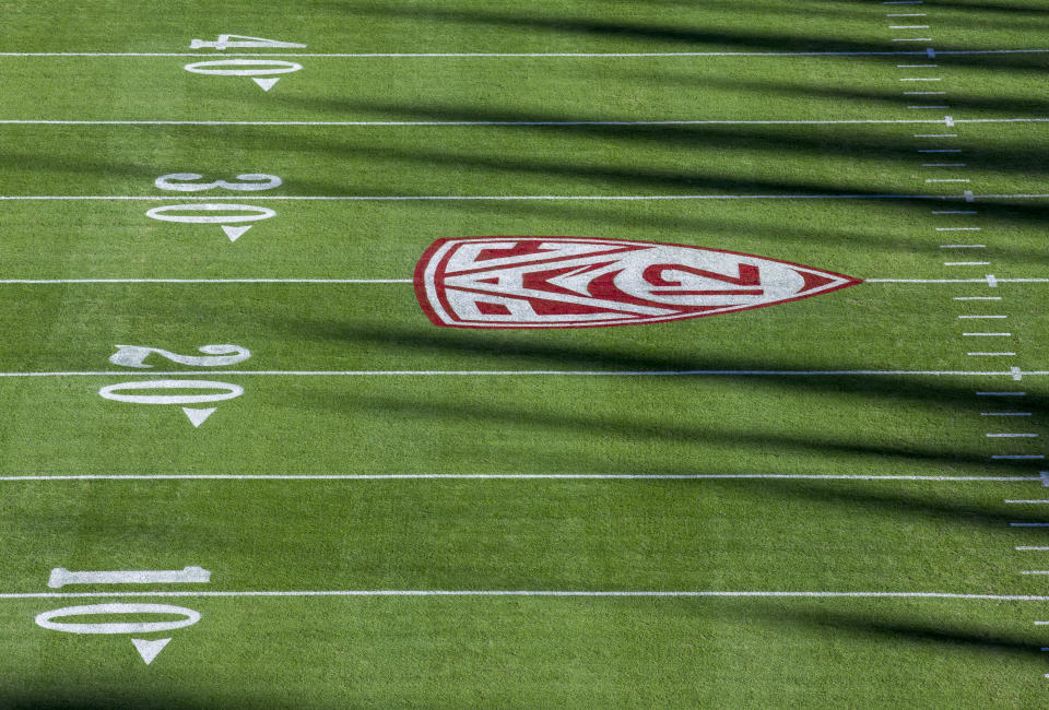 The shadows over college football are growing longer. (Photo by David Madison/Getty Images)