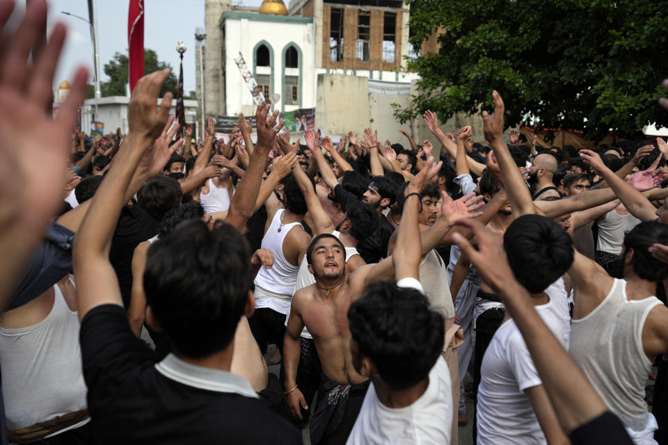 Shiite Muslims beat their chests during a procession to mark Ashoura, in Islamabad, Pakistan, Friday, July 28, 2023. Ashoura is the Shiite Muslim commemoration marking the death of Hussein, the grandson of the Prophet Muhammad, at the Battle of Karbala in present-day Iraq in the 7th century. (AP Photo/Rahmat Gul)