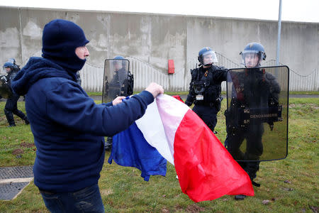 Prison wardens face off with French gendarmes as they block the Maubeuge jail during a nationwide protest, France, January 24, 2018. REUTERS/Pascal Rossignol