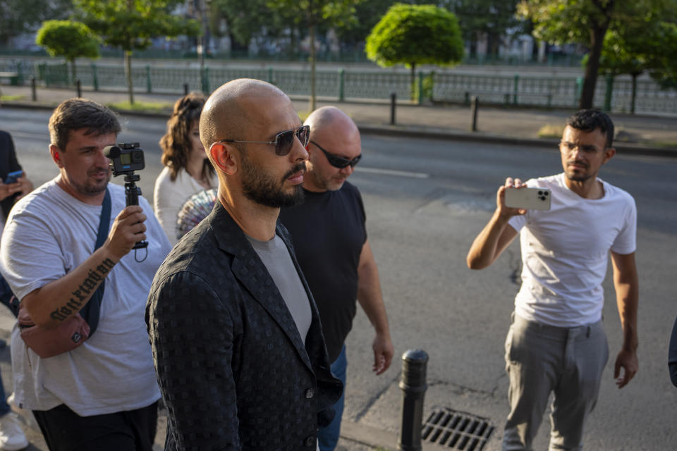 Andrew Tate leaves the Court of Appeal in Bucharest, Romania, Thursday, July 6, 2023. Andrew Tate, the divisive social media personality and former professional kickboxer who is charged in Romania with rape, human trafficking, and forming a criminal gang to sexually exploit women, lost an appeal on Thursday against a court's earlier decision to keep him under house arrest, his spokesperson said. (AP Photo/Andreea Alexandru)