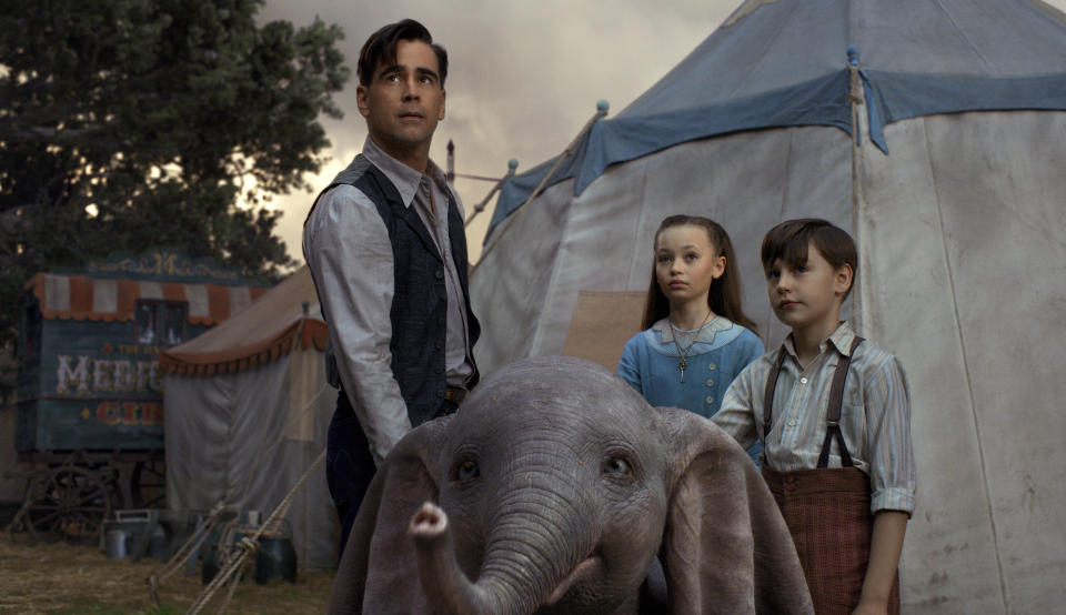 This image released by Disney shows Colin Farrell, Nico Parker and Finley Hobbins in a scene from "Dumbo." (Disney via AP)