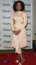 <p> Winfrey wowed on the red carpet at the Annual Directors Guild Of America Honors in New York in 2004. The presenter looked pretty in a long-sleeved peach-coloured midi dress, which featured a sash neckline and silky fabric detailing. She finished off the elegant ensemble with silver jewellery and a pair of open-toed heels with bow detailing. </p>