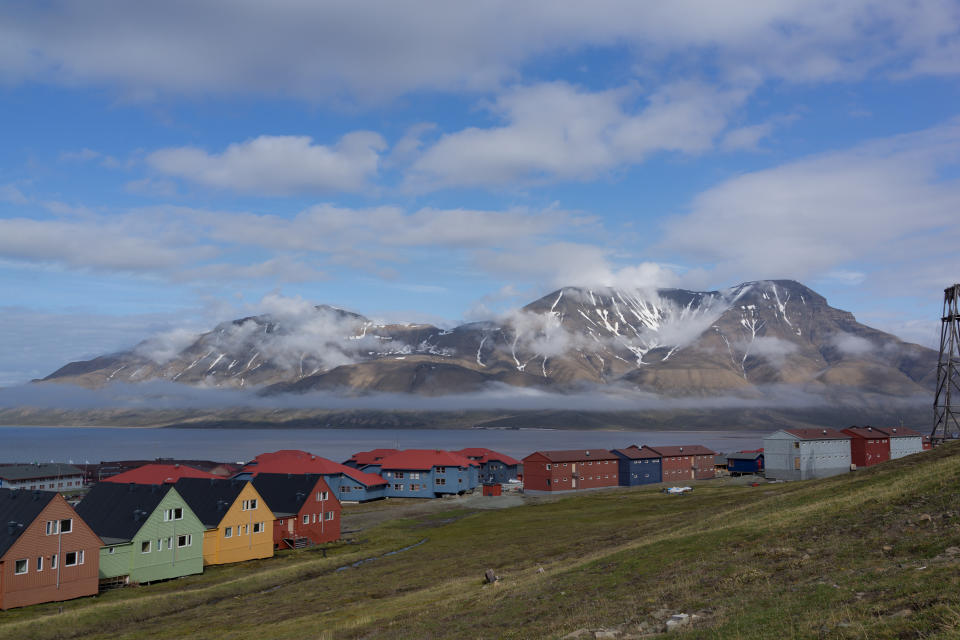 Detached houses with mountains in background, Longyearbyen, Svalbard, Norway