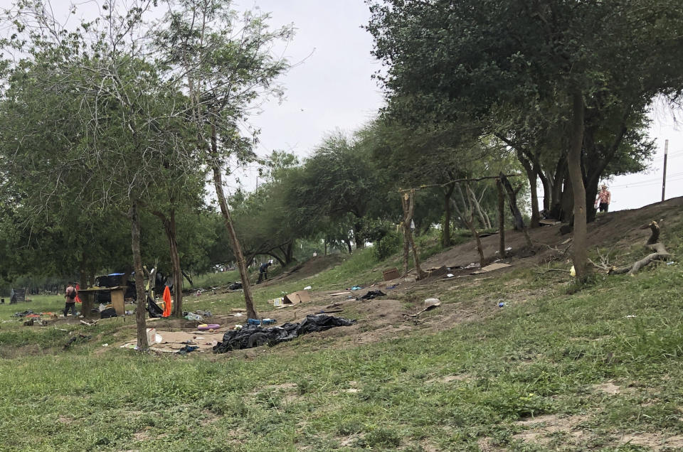 Makeshift tents and debris are seen at a migrant camp in Matamoros, Mexico, Friday, April 21, 2023. About two dozen makeshift tents in the area were set ablaze and destroyed, across the border from Texas this week, witnesses said. (AP Photo/Valerie Gonzalez)