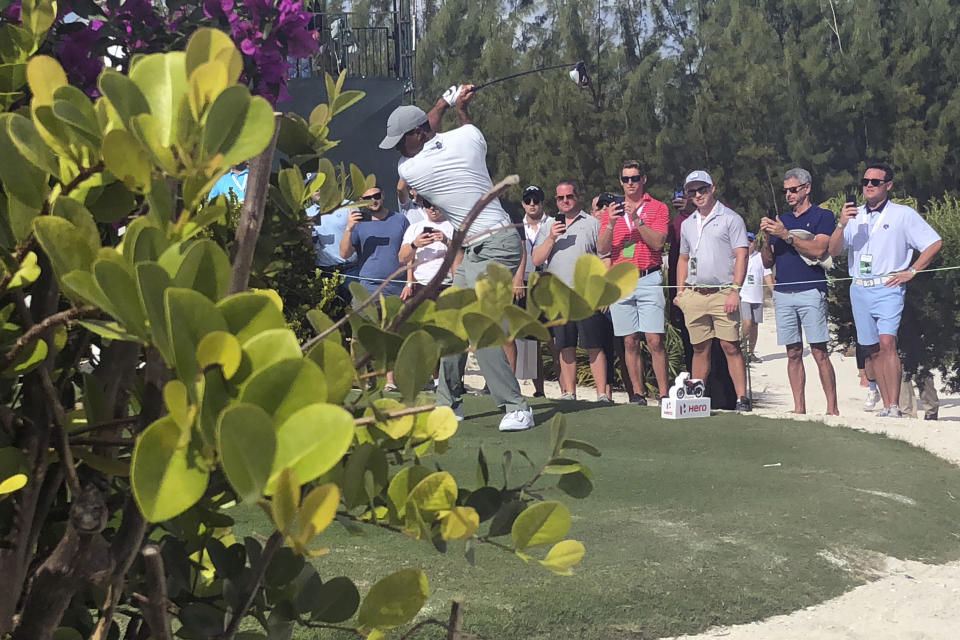 Tiger Woods hits on the par-5 11th hole on his way to an eagle at Albany Golf Club during the second round of the Hero World Challenge in Nassau, Bahamas, Thursday Dec. 5 2019. Woods shot 66. (AP Photo/Doug Ferguson)