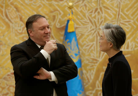 U.S. Secretary of State Mike Pompeo talks with South Korean Foreign Minister Kang Kyung-wha before meeting with South Korean President Moon Jae-in at the presidential Blue House in Seoul, South Korea Ocober 7, 2018. Ahn Young-joon/Pool via REUTERS