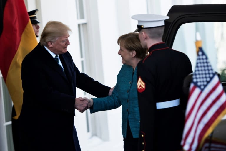 A White House visit by German Chancellor Angela Merkel began cordially with a handshake, but later Merkel's suggestion of another one went unheard or ignored by President Donald Trump