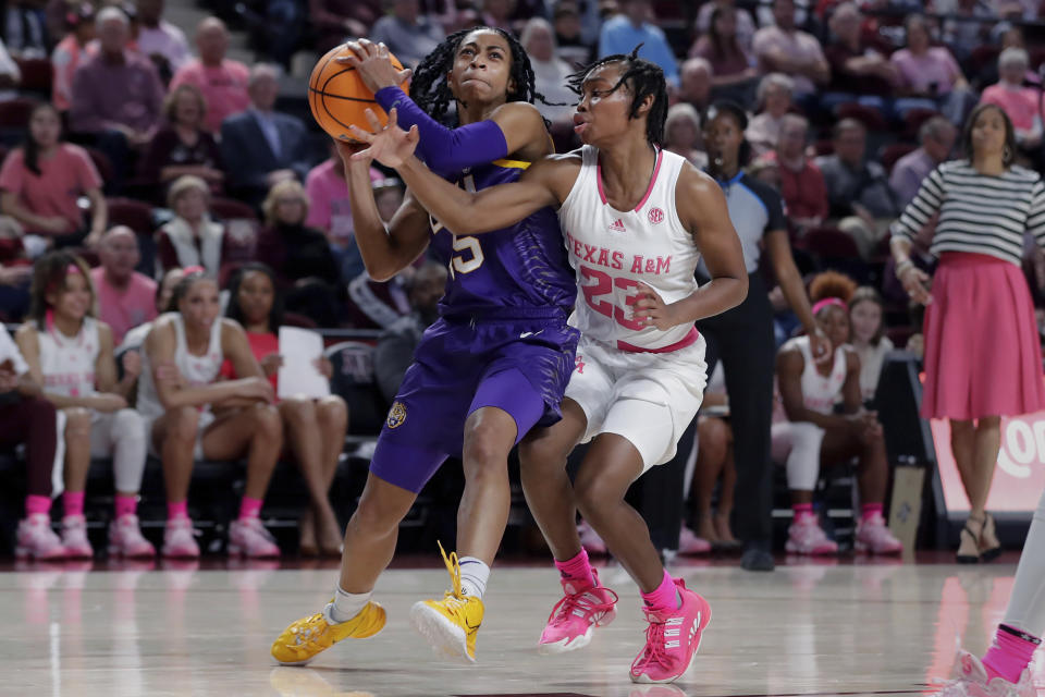 LSU guard Alexis Morris, left, drives to the basket in front of Texas A&M guard McKinzie Green (23) during the first half of an NCAA college basketball game, Sunday, Feb. 5, 2023, in College Station, Texas. (AP Photo/Michael Wyke)