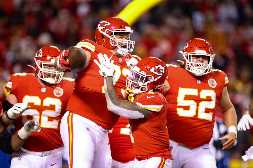 Nick Allegretti of the Kansas City Chiefs celebrates after scoring a touchdown with teammates in the third quarter of the game against the Pittsburgh Steelers in the NFC Wild Card Playoff game at Arrowhead Stadium.