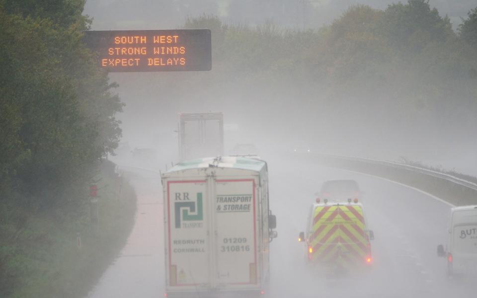 Drivers on the M5 have to contend with water spray and winds