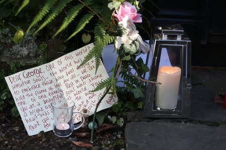 Tributes are seen outside the house of singer George Michael, in north London, Britain December 26, 2016. REUTERS/Neil Hall
