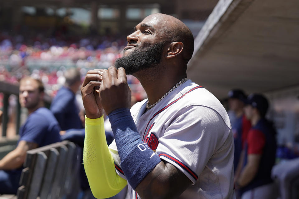 Atlanta Braves' Marcell Ozuna stands in the dugout during the first inning of the team's baseball game against the Cincinnati Reds, Sunday, July 3, 2022, in Cincinnati. (AP Photo/Jeff Dean)