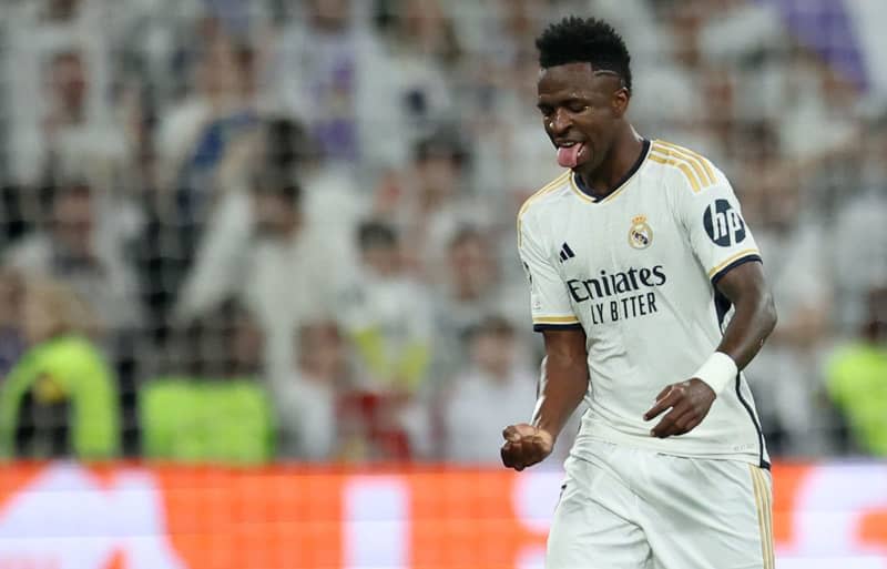 Real Madrid's Vinicius Junior celebrates scoring his side's first goal during the UEFA Champions League round of 16 second leg soccer match between Real Madrid and RB Leipzig at Santiago Bernabeu Stadium. Jan Woitas/dpa