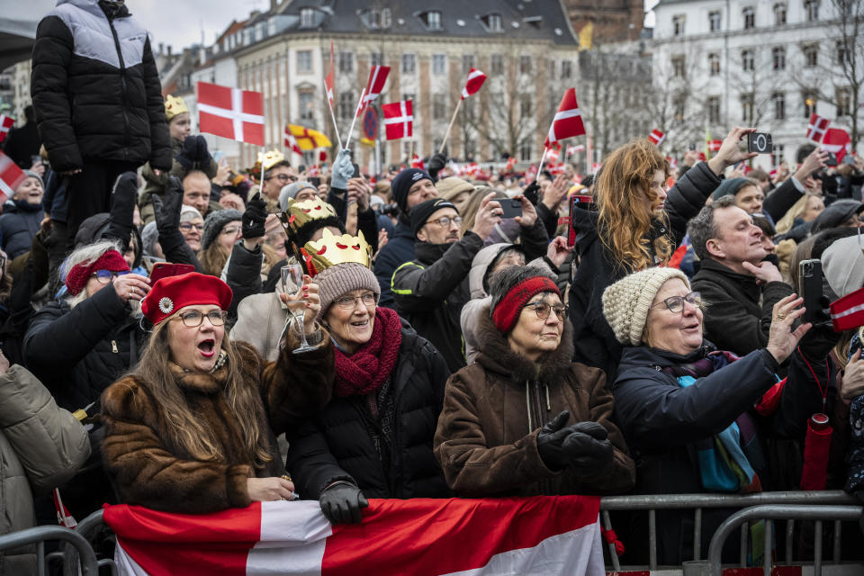 People gather to celebrate at Christiansborg Palace Square in Copenhagen, Denmark, Sunday, Jan. 14, 2024. Queen Margrethe II has become Denmark's first monarch to abdicate in nearly 900 years when she handed over the throne to her son, who has become King Frederik X. (Emil Nicolai Helms/Ritzau Scanpix via AP)