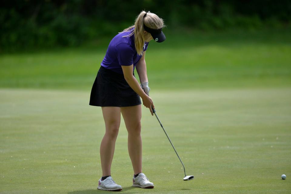 Albany's Kaitlyn Lahr watches the ball come off the putter as Albany and Cathedral boys and girls golf compete in the Section 6-2A tournament on Tuesday, June 7, 2022, at Blackberry Ridge Golf Course in Sartell. 