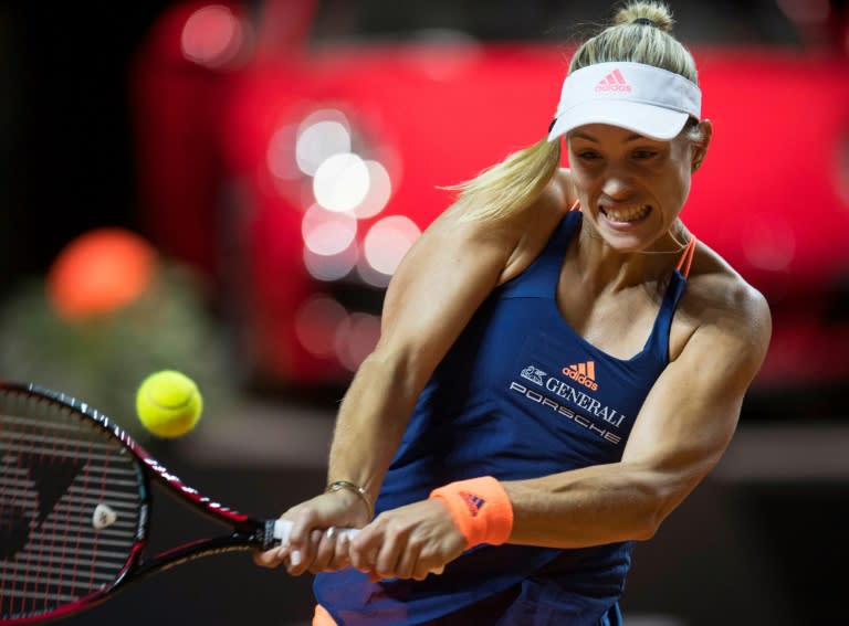 Germany's Angelique Kerber returns the ball to France's Kristina Mladenovic in their second round match on April 27, 2017